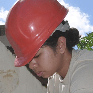 construction-worker-smallest Young woman with construction helmut on