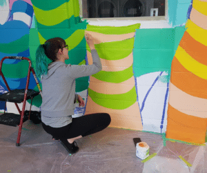 Indoor Mural 04 Bryn, painting a section of a tree
