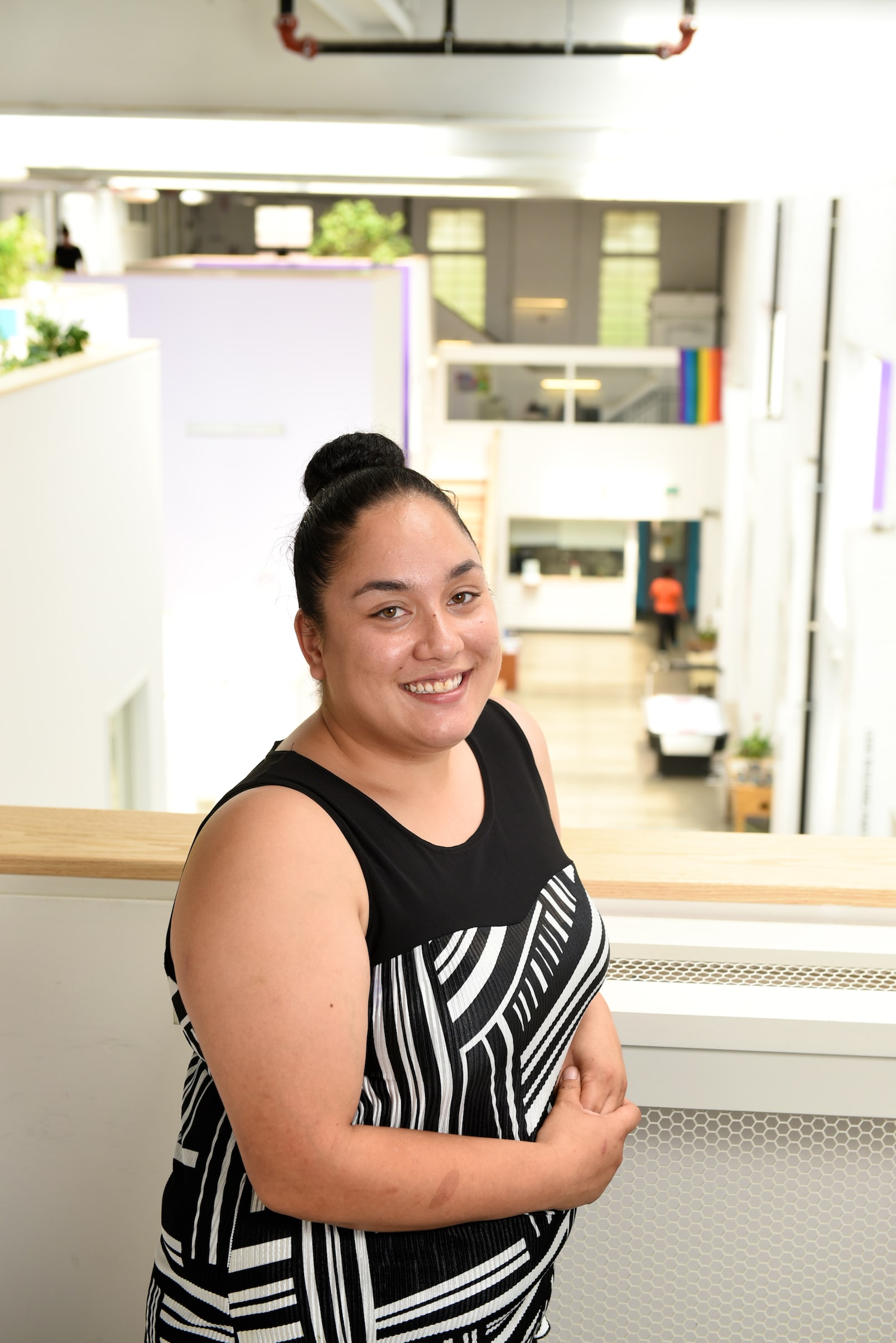 Image of peer researcher smiling towards camera