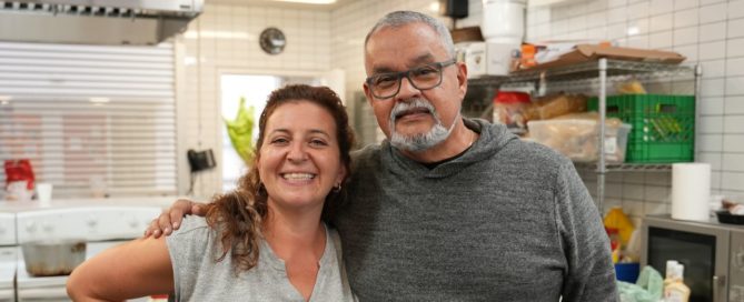 Food coordinator Leanne Rabinowitz and Chef Eugene Silva posing for a photo