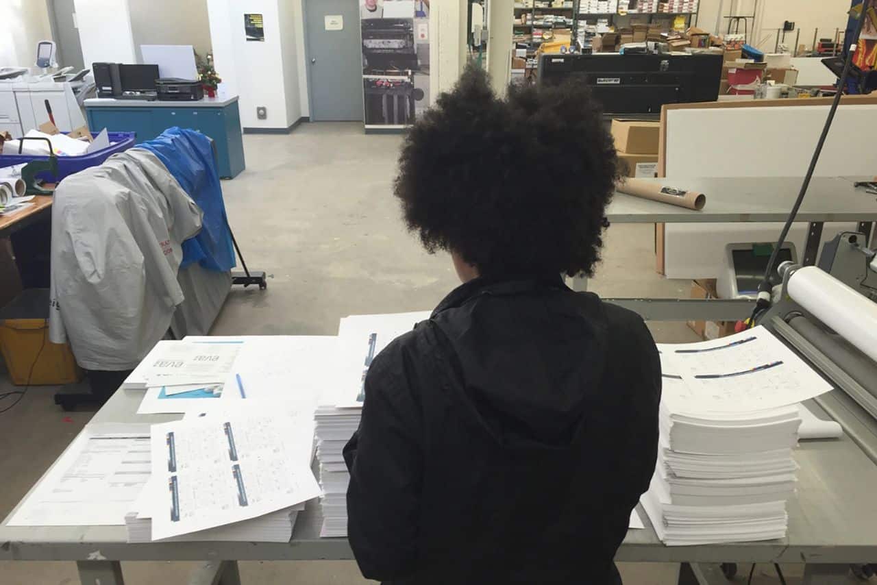 Young person working in the print shop