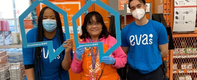 Eva's staff with a Home Depot employee at in-store fundraising event